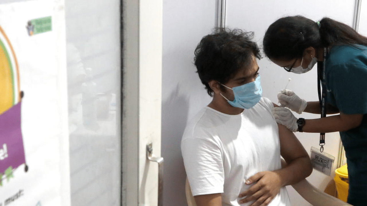 A man receives a dose of COVISHIELD, a coronavirus disease vaccine manufactured by Serum Institute of India, at a vaccination centre in Mumbai, India, May 1, 2021. Credit: Reuters Photo