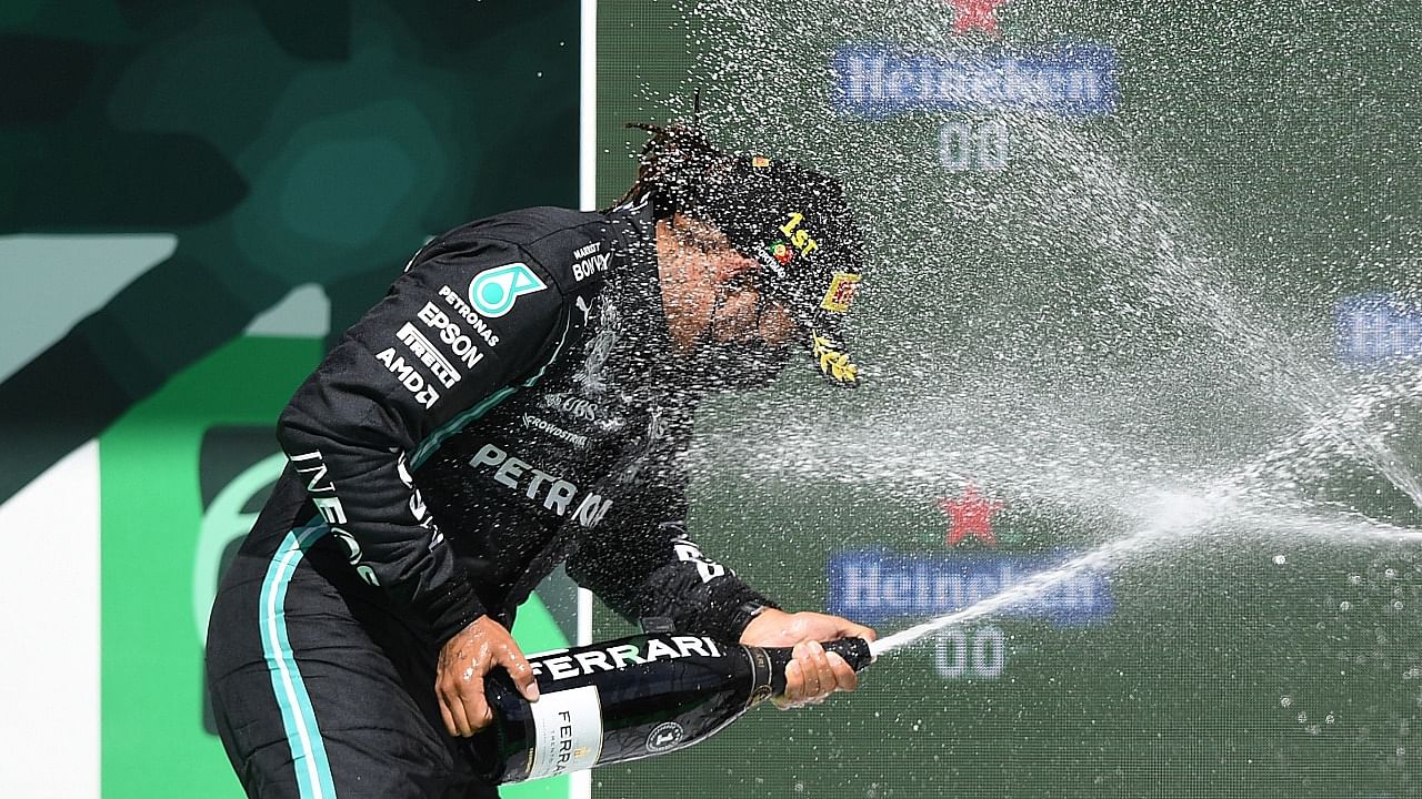 Hamilton celebrates 97th Grand Prix win. Credit: AFP Photo