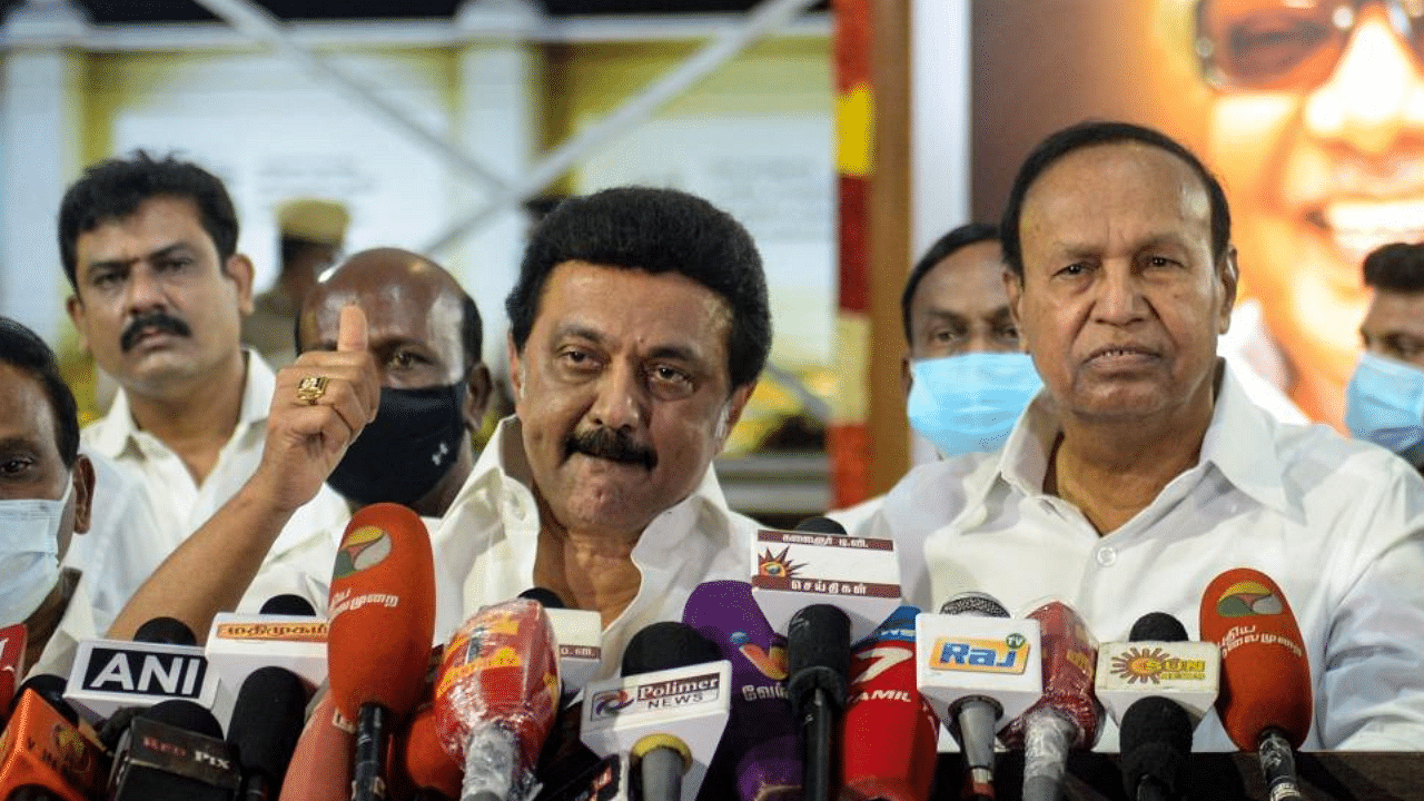 Chief Minister elect of Tamil Nadu MK Stalin (L) of Dravida Munnetra Kazhagam (DMK) party, gestures as he delivers a speech during a press conference after winning the Tamil Nadu State election, at the memorial of his father and late Chief Minister of Tamil Nadu, M. Karunanidhi, in Chennai, on May 2, 2021. Credit: AFP Photo