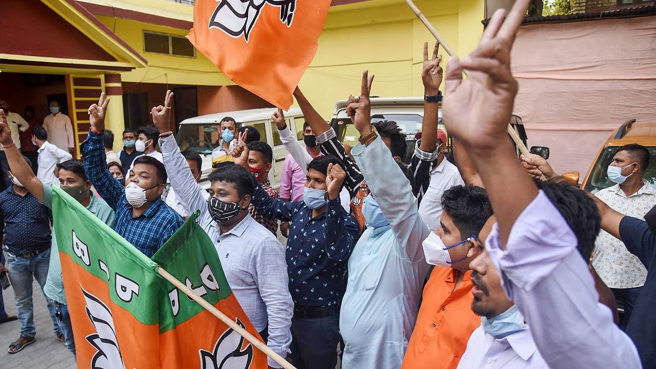Activists of the Bharatiya Janata Party celebrate after getting the majority in the Assam state Assembly elections. Credit: PTI Photo