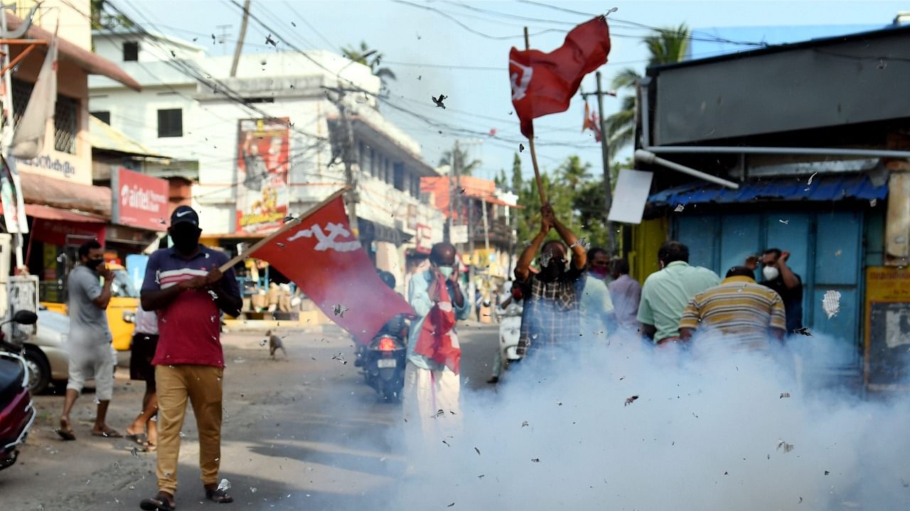 Left Democratic Front (LDF) activists celebrate party's winning trend during counting day of Kerala State Assembly Polls, in Thiruvananthapuram , Sunday, May 2, 2021. Credit: PTI Photo