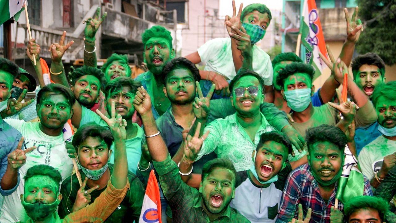 Trinamool Congress activists celebrate their party's winning trend during counting day of West Bengal Assembly Election 2021, in South Dinajpur district, Sunday, May 2, 2021. Credit: PTI Photo