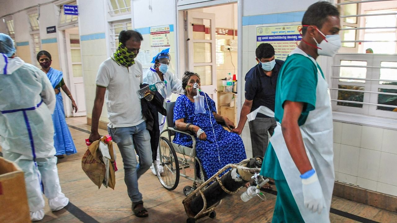 A COVID-19 patient on oxygen support at a hospital in Bengaluru. Credit: PTI Photo