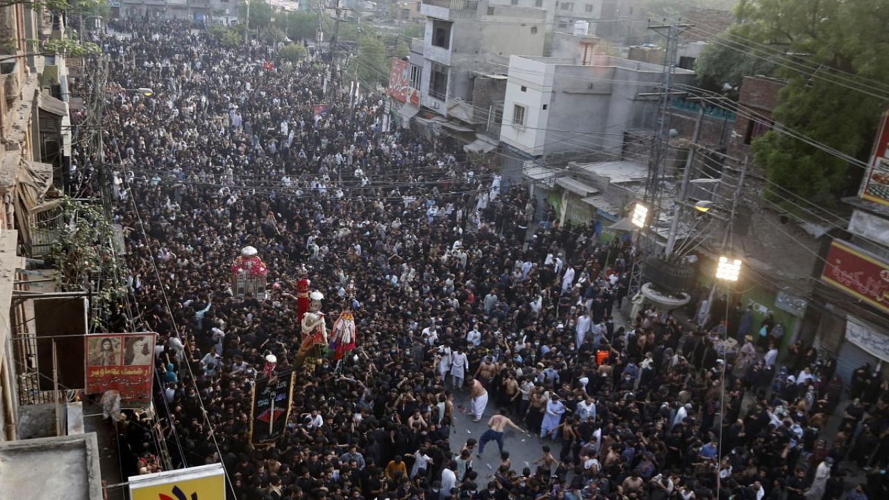 Pakistani Shiite Muslims take part in a procession commemorating the death anniversary of Imam Ali, the son-in-law and cousin of the Prophet Muhammad and the first Imam of the Muslim Shiites, in Lahore, Pakistan. Credit: AP Photo