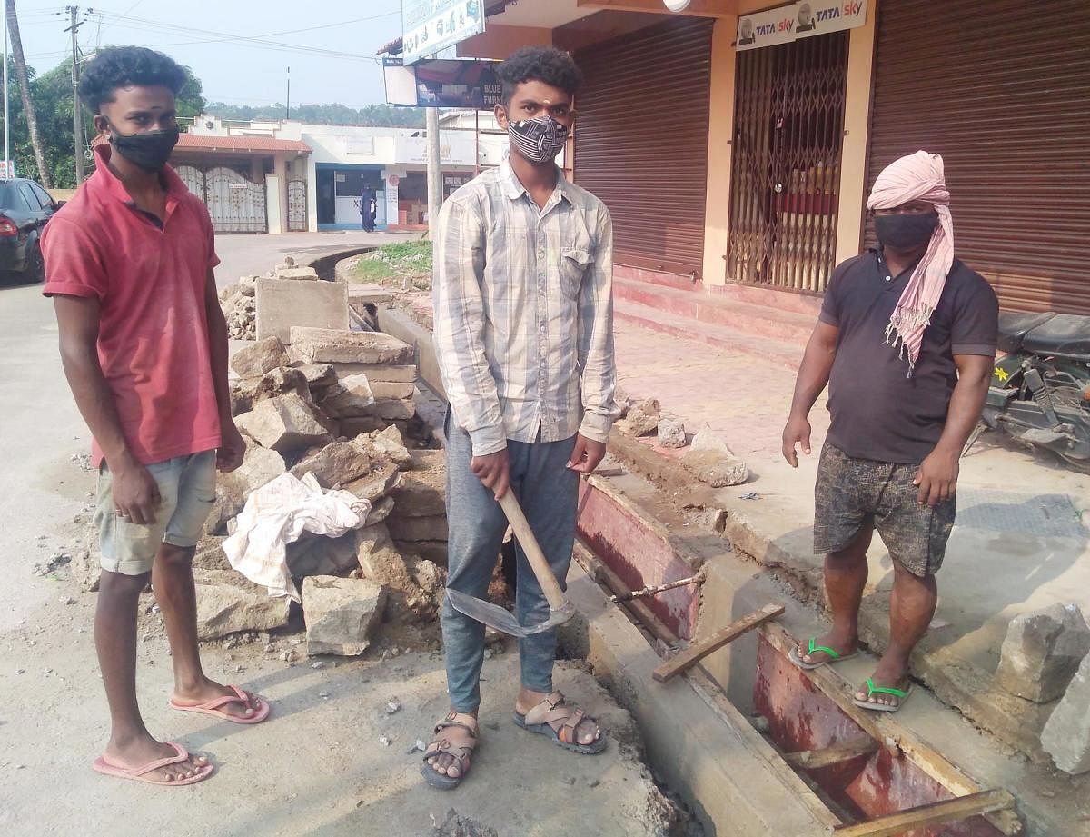 Degree college students work on a drain in Gonikoppa.