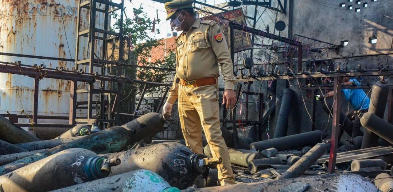 Police inspect the site after an explosion at an oxygen refilling plant in Chinhat area of Lucknow, Wednesday, May 5, 2021. Credit: PTI Photo