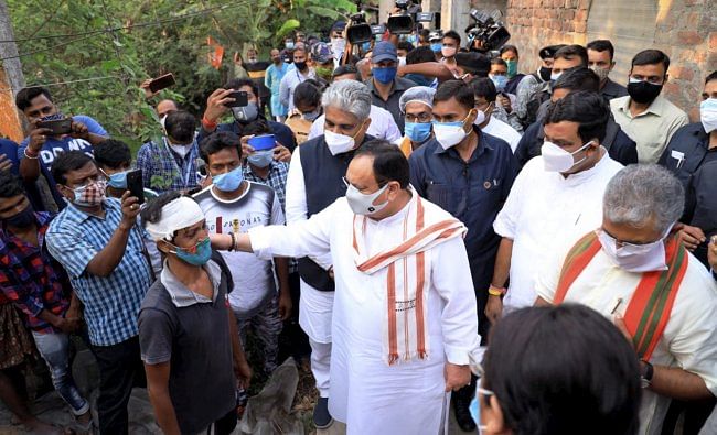 BJP National President JP Nadda accompanied by party leaders meets post-poll violence victims, in Sonarpur, Bengal. Credit: PTI Photo