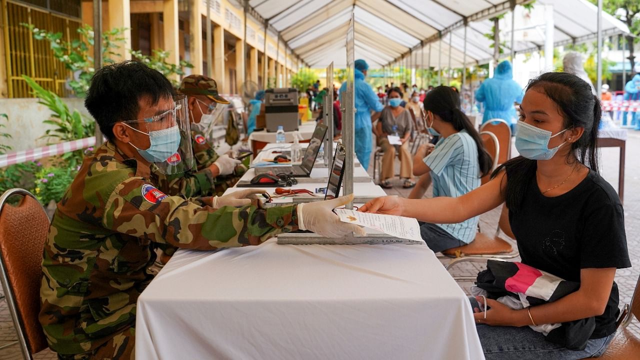 Cambodian army members vaccinate people in Phnom Penh. Credit: Reuters File Photo