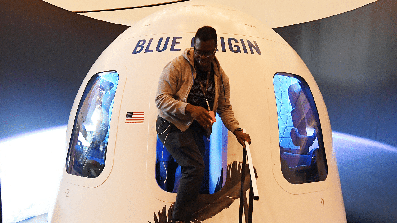 participants leave the Blue Origin Space Simulator during the Amazon Re:MARS conference on robotics and artificial intelligence in Las Vegas. Credit: AFP Photo