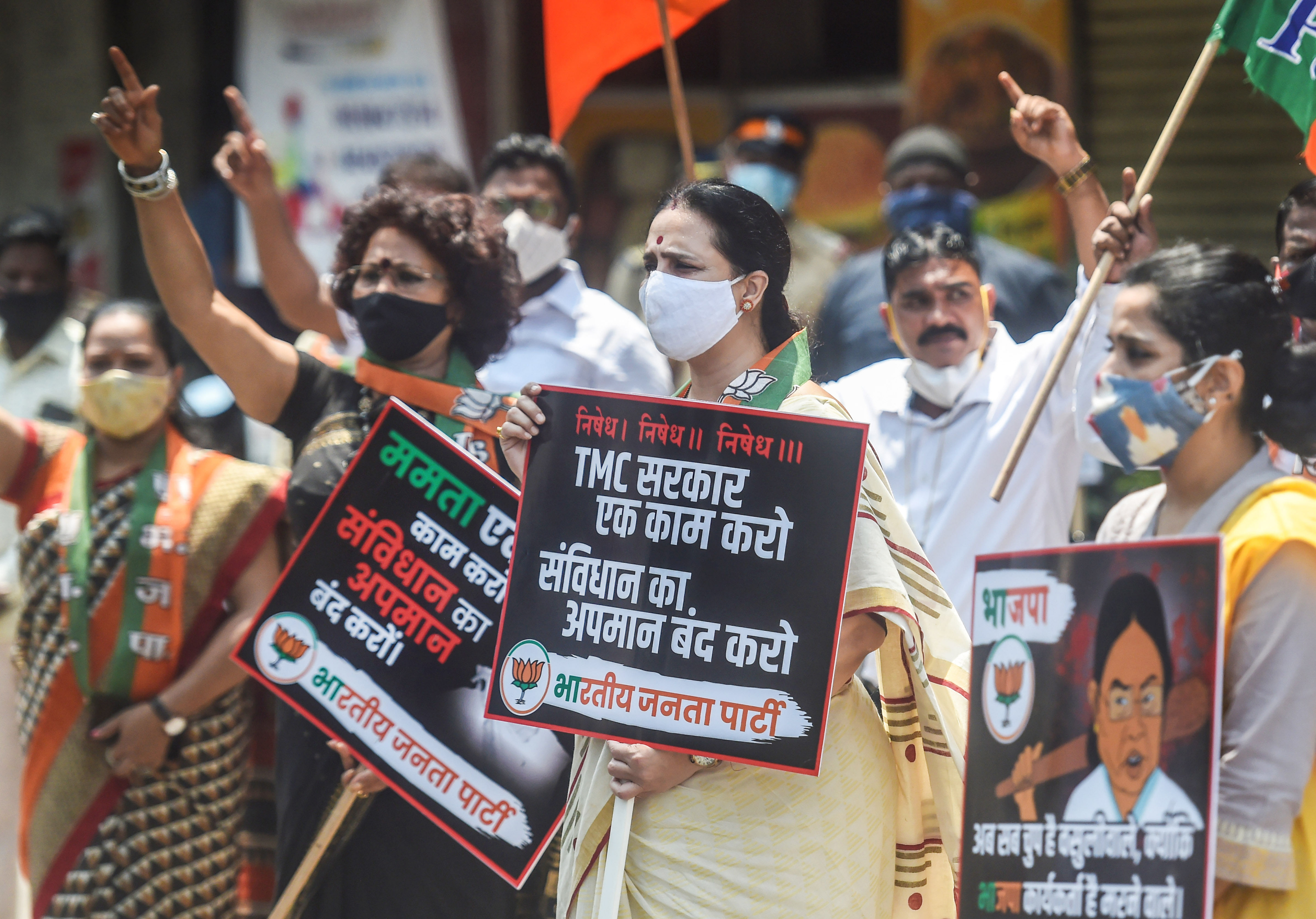 BJP leader Chitra Wagh along with party workers takes part in a protest against alleged attack on the party workers in West Bengal. Credit: PTI/ Representative