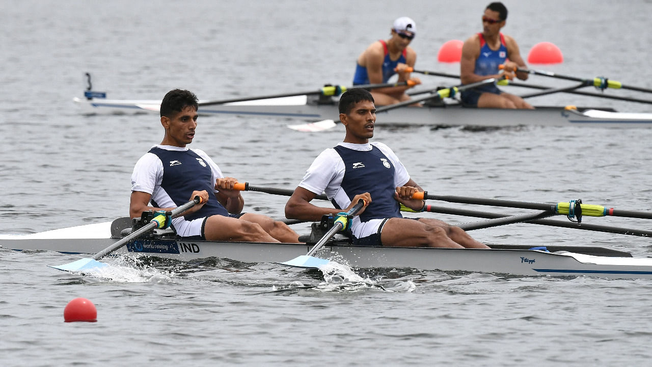 India's Arjun Lal Jat and Arvind Singh (foreground) cross the finish line in the lightweight men's double sculls heat at the 2021 World Rowing Asia-Oceania Olympic and Paralympic Continental Qualifying Regatta in Tokyo. Credit: AFP Photo