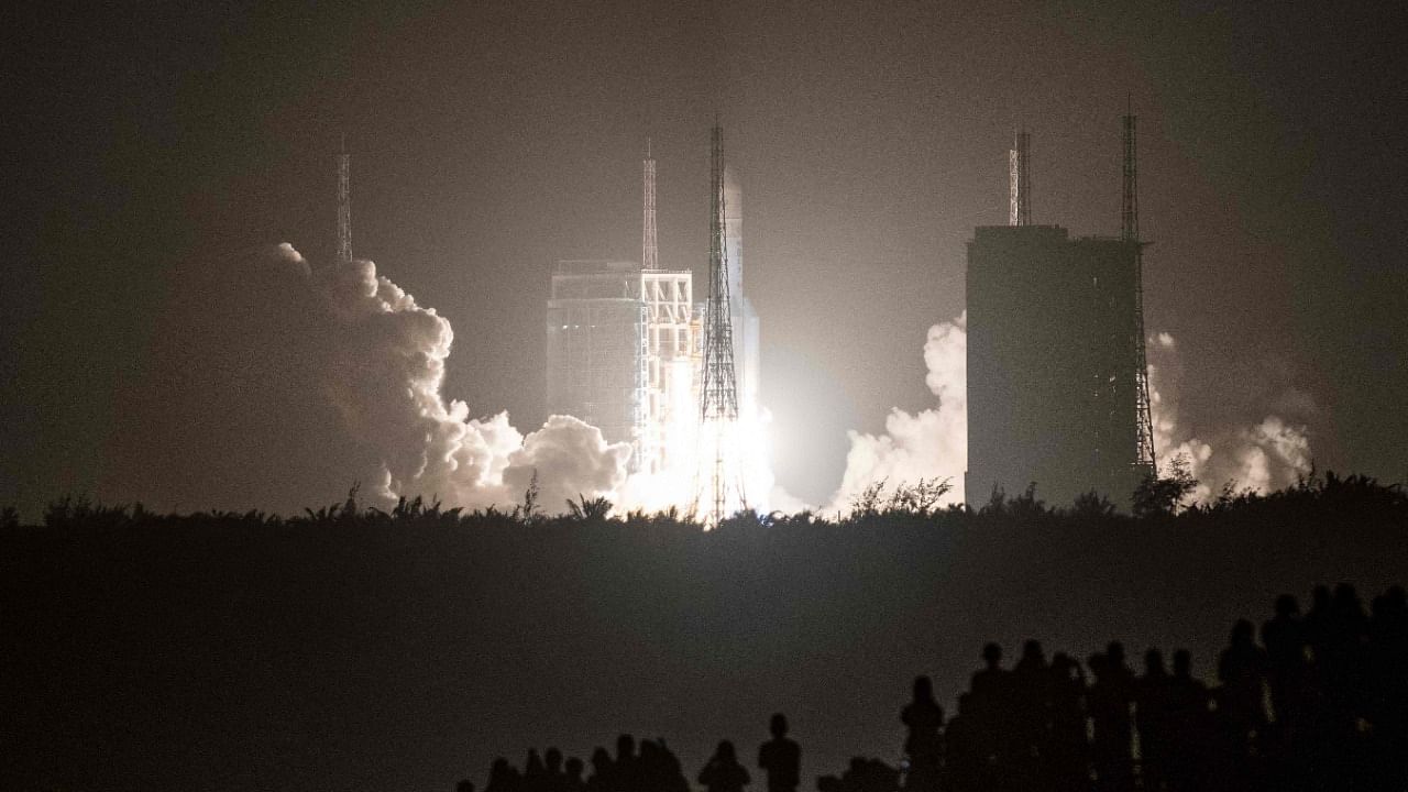 In this file photo a Long March 5B rocket carrying China's Chang'e-5 lunar probe launches from the Wenchang Space Center on China's southern Hainan Island on November 24, 2020, on a mission to bring back lunar rocks, the first attempt by any nation to retrieve samples from the moon in four decades. Credit: AFP Photo