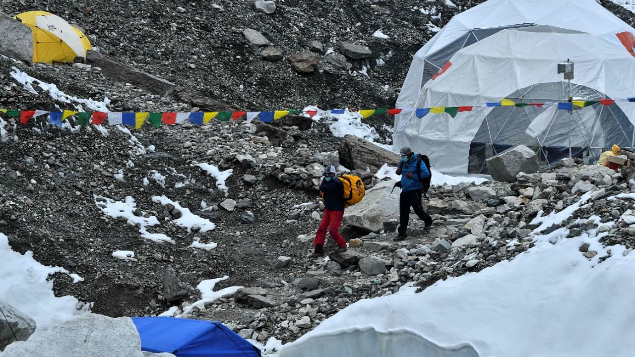 A coronavirus outbreak on Mount Everest has seen dozens of people evacuated by helicopter from the foot of the world's highest peak, derailing Nepal's plans for a record climbing season. Credit: AFP Photo