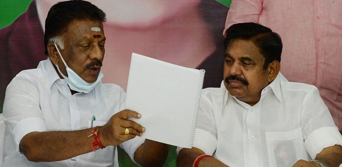  Edappadi.K. Palanisamy (R) talks to O. Pannerselvam during the release of the party election manifesto. Credit: AFP Photo