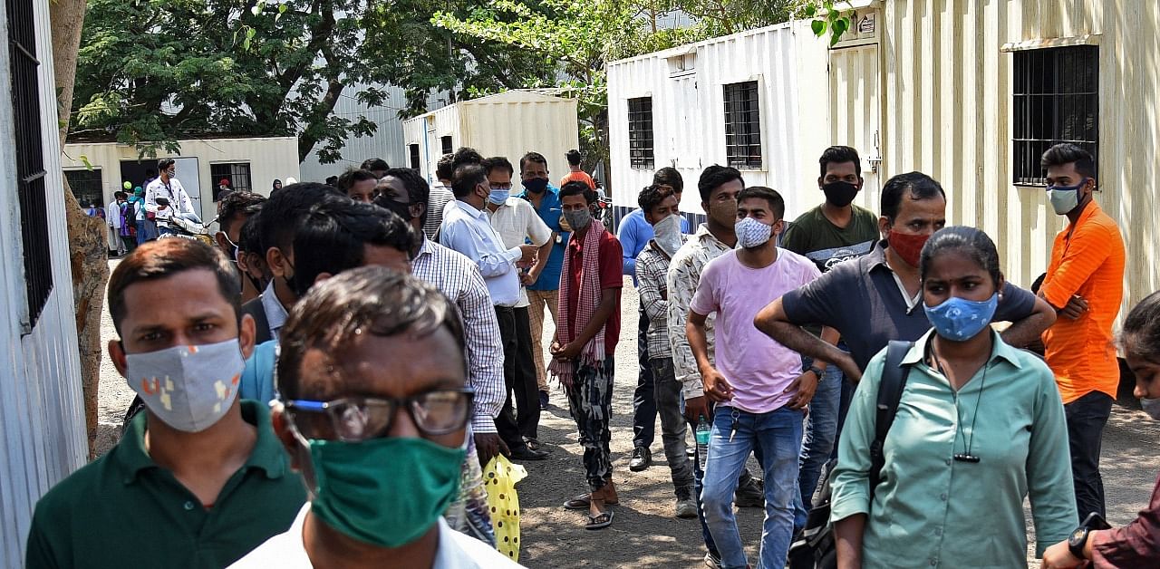 People wait to get tested for Covid-19 in Mumbai. Credit: AFP Photo