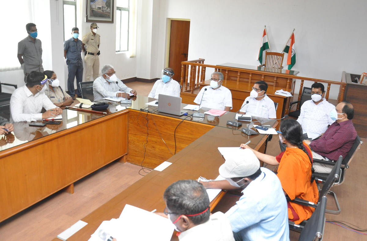 District incharge Minister S Suresh Kumar holds meeting with the officials in Chamarajanagar, on Thursday.. Credit: DH Photo