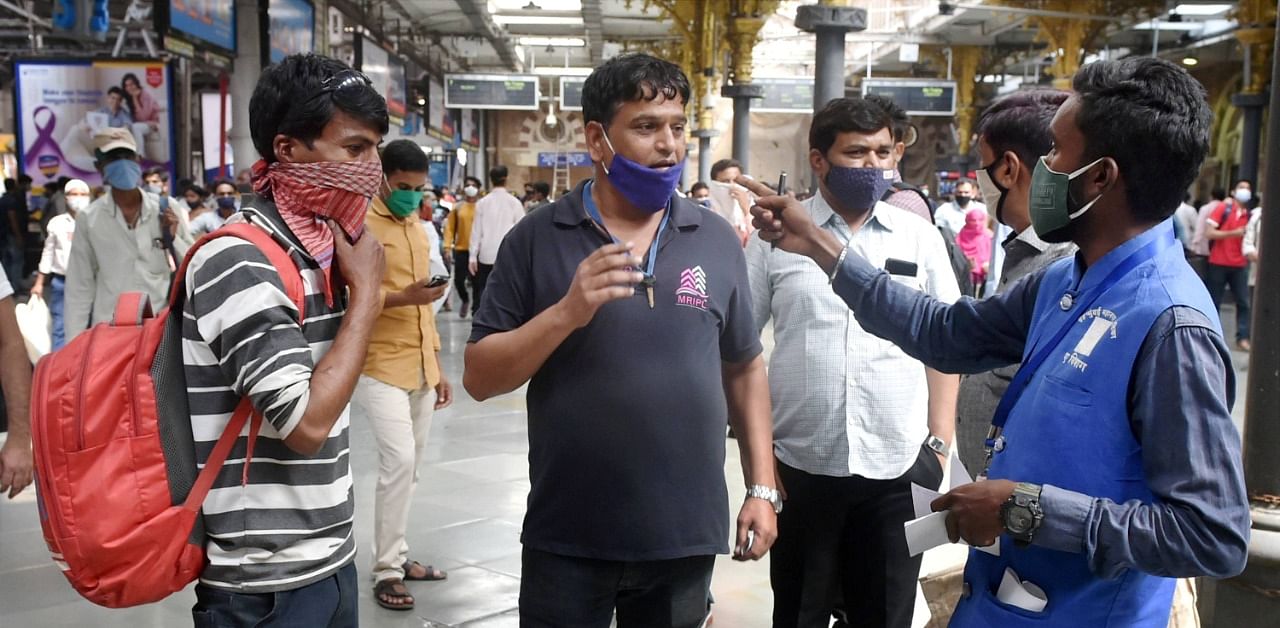 Commuters being fined for not wearing masks in Mumbai. Credit: PTI Photo