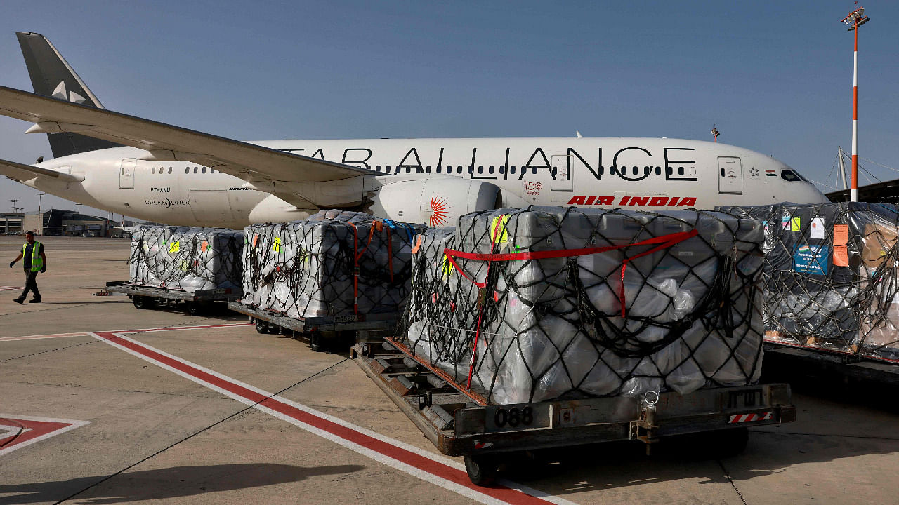 Workers load medical aid to be flown in an Air India aeroplane to India, at Israeli's ben Gurion Airport. Credit: AFP Photo