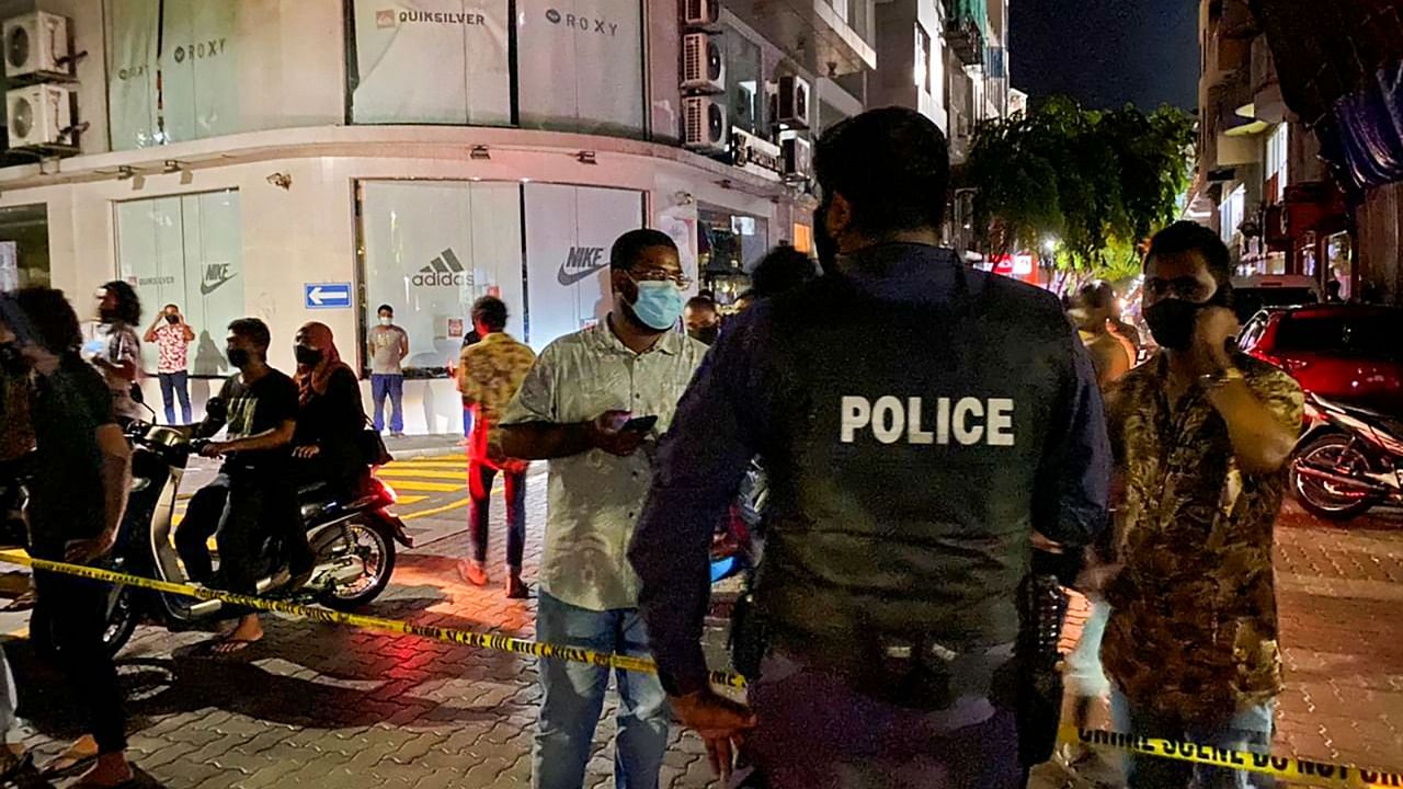 Police secure a site after a suspected bomb blast injured former Maldives president and current parliament speaker Mohamed Nasheed in Male on May 6, 2021. Credit: AFP Photo