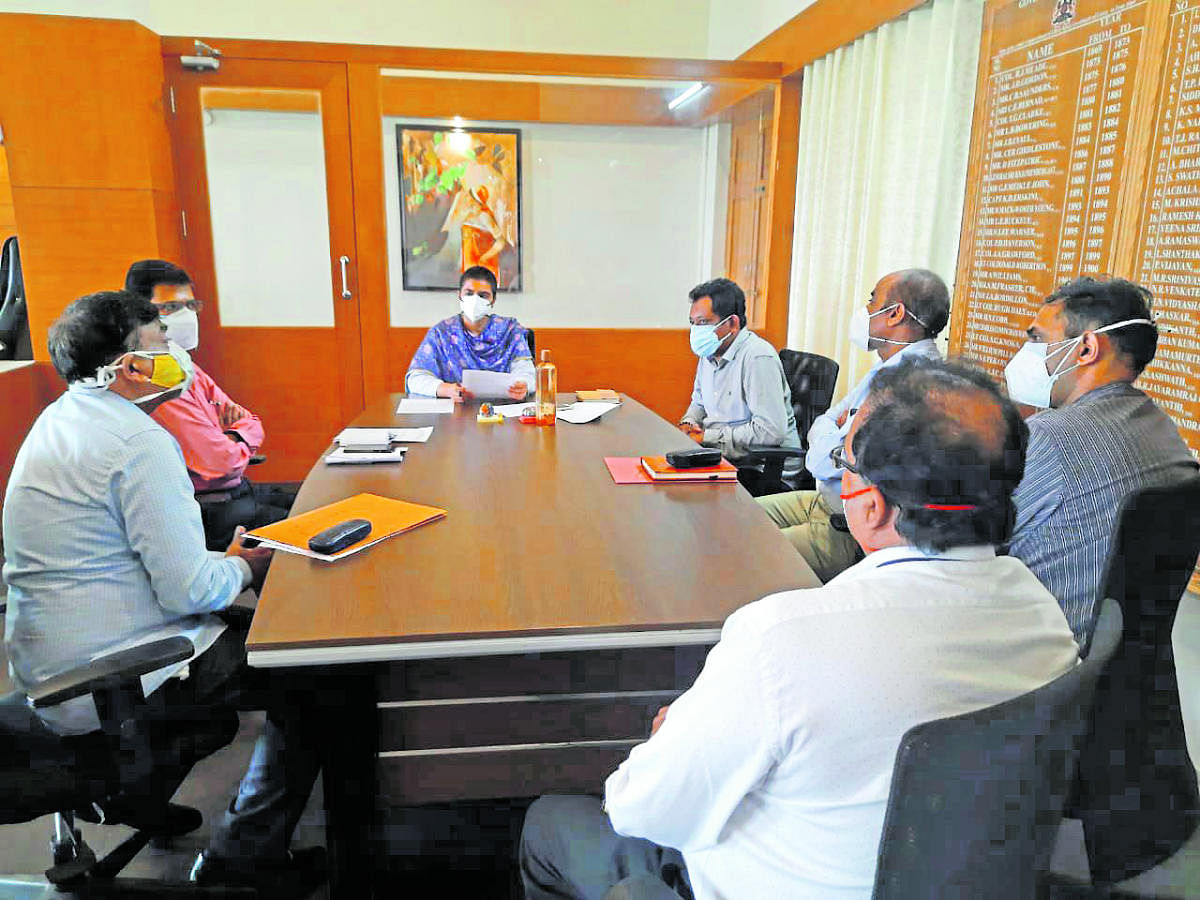Deputy Commissioner Charulata Somal chairs a meeting of health officials in Madikeri on Friday.