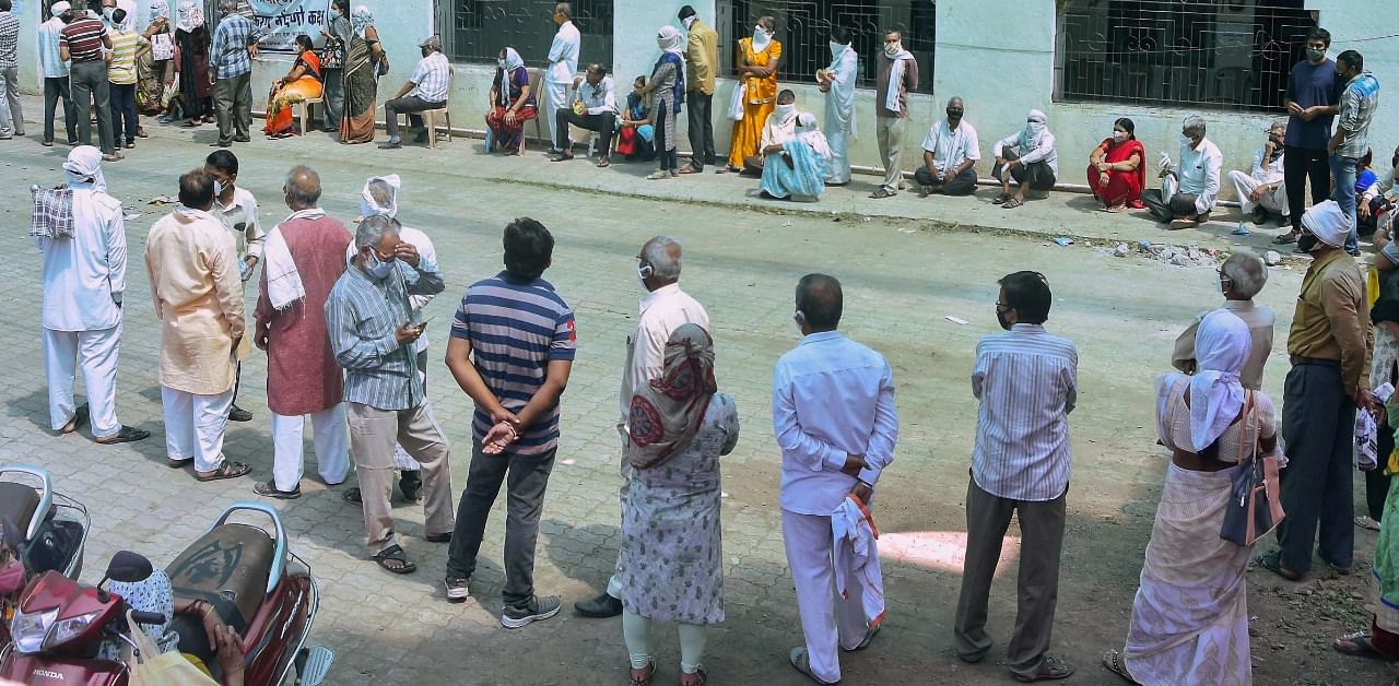 People wait to receive a dose of the Covid-19 vaccine in Amravati. Credit: PTI Photo
