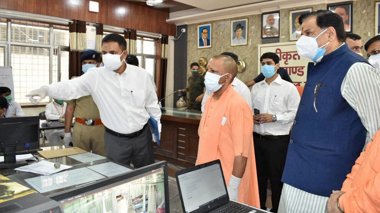 UP CM Yogi Adityanath inspects the integrated command and control center of Moradabad. Credit: PTI Photo/Twitter/@myogiadityanath