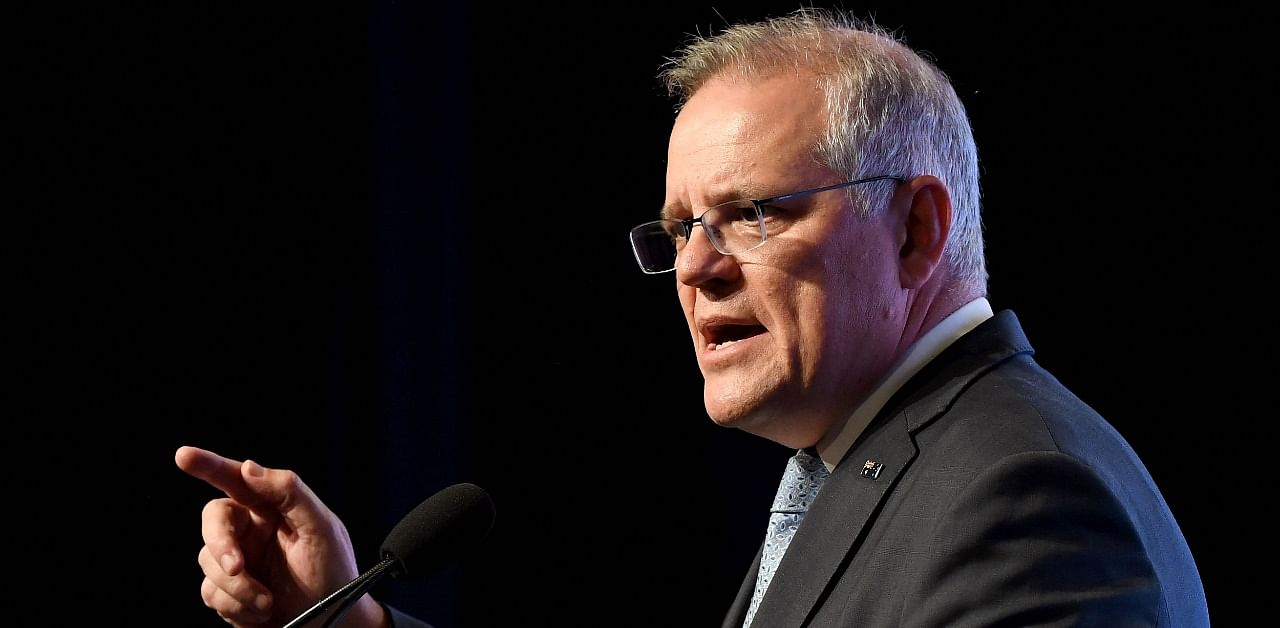 Morrison said that Australia will charter three repatriation flights from India. Credit: AFP Photo