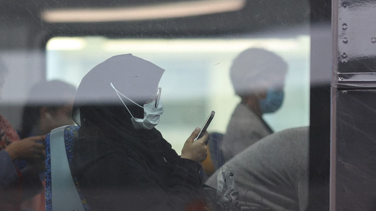 More than five million people living in and around Sydney must wear masks on public transport and in most public venues. Credit: Reuters Photo