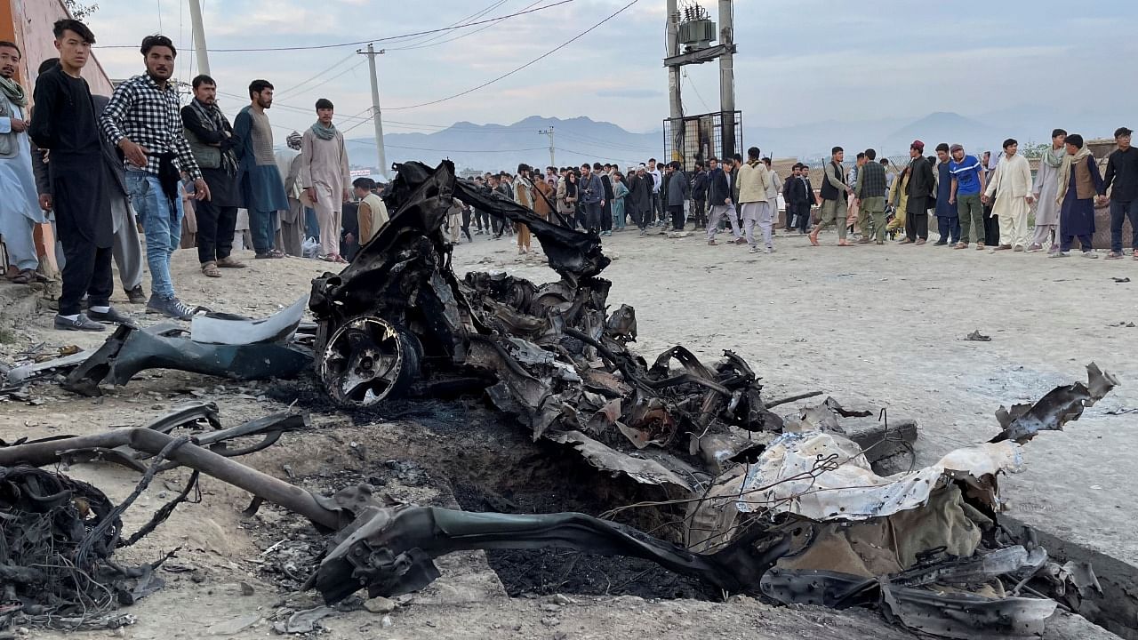 People stand at the site of a blast in Kabul, Afghanistan May 8, 2021. Credit: Reuters Photo