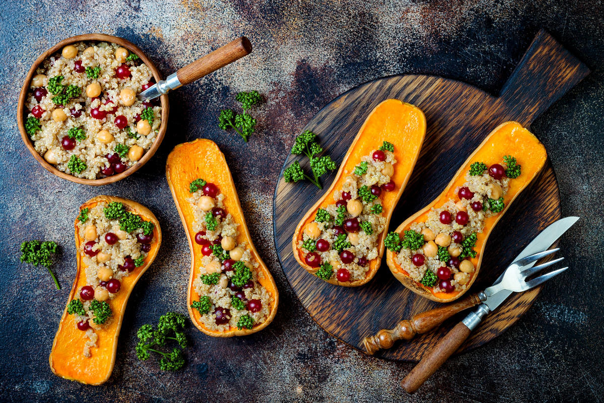 Stuffed butternut squash with chickpeas, cranberries, quinoa cooked in nutmeg, cloves and cinnamon