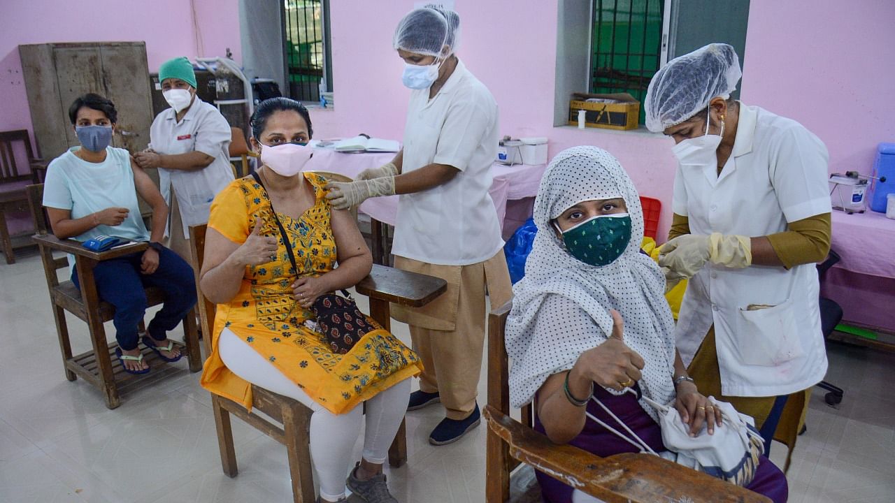 Registered beneficiaries receive their Covid-19 vaccine shots in Thane, Saturday, May 8, 2021. Credit: PTI Photo