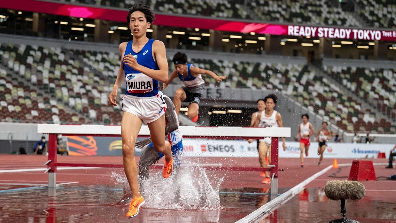 Ryuji Miura of Japan competes and sets a national record in the men's 3000m steeple-chase during an athletics test event for the Tokyo Olympics at the National Stadium in Tokyo on May 9, 2021. Credit: AFP Photo