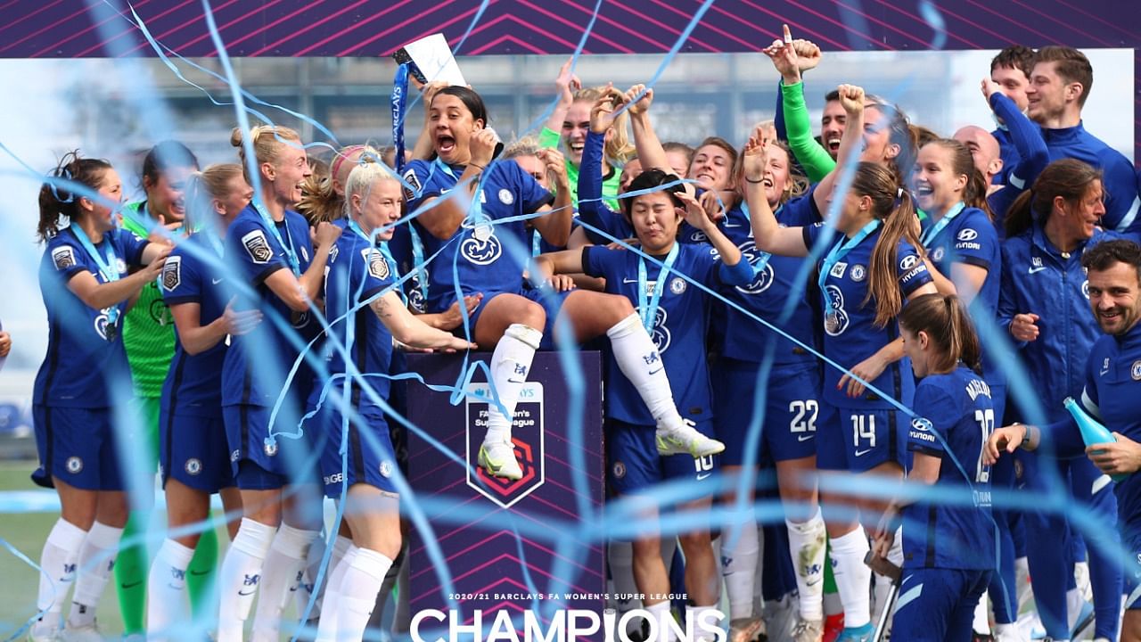 Chelsea FC Women players celebrate winning back-to-back women's Super League titles. Credit: Twitter/@ChelseaFCW