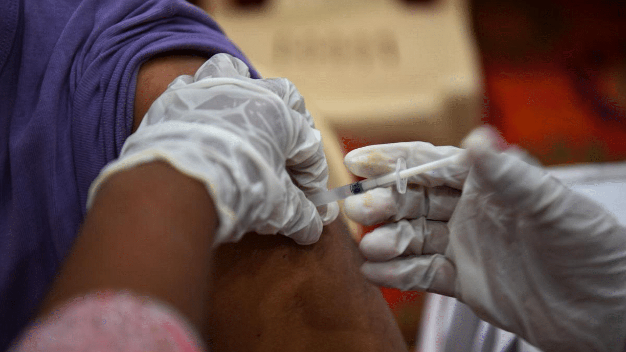 A total of 1,21,00,410 citizens in the state have till now received their first vaccine dose and 20,67,190 have got their second dose. Credit: AFP Photo