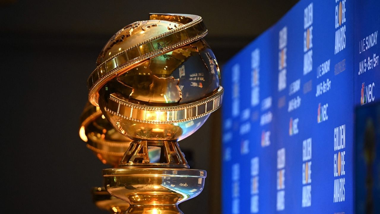 Golden Globe trophies are set by the stage. Credit: AFP File Photo