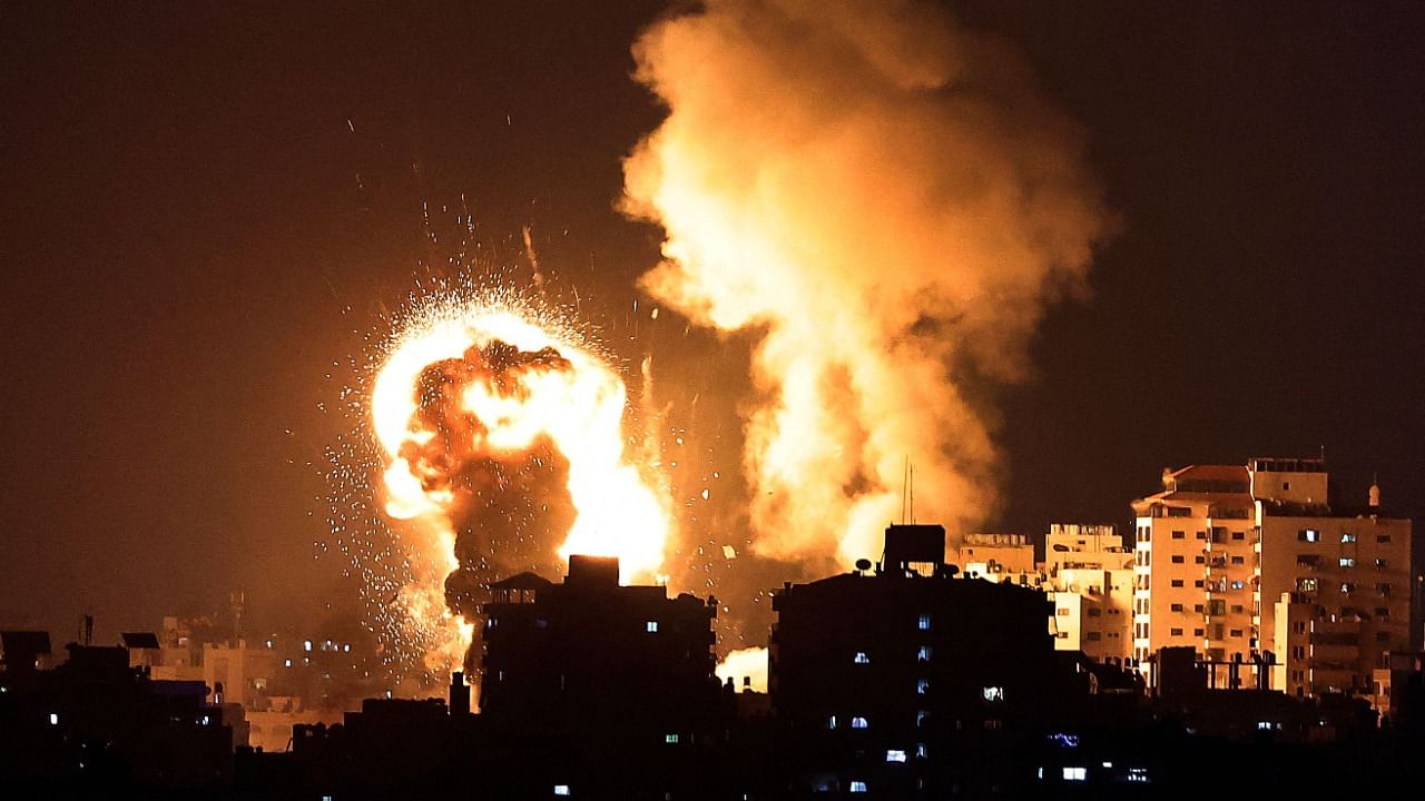 Fire billows from Israeli air strikes in the Gaza Strip, controlled by the Palestinian Islamist movement Hamas, which has killed 20 so far. Credit: AFP Photo