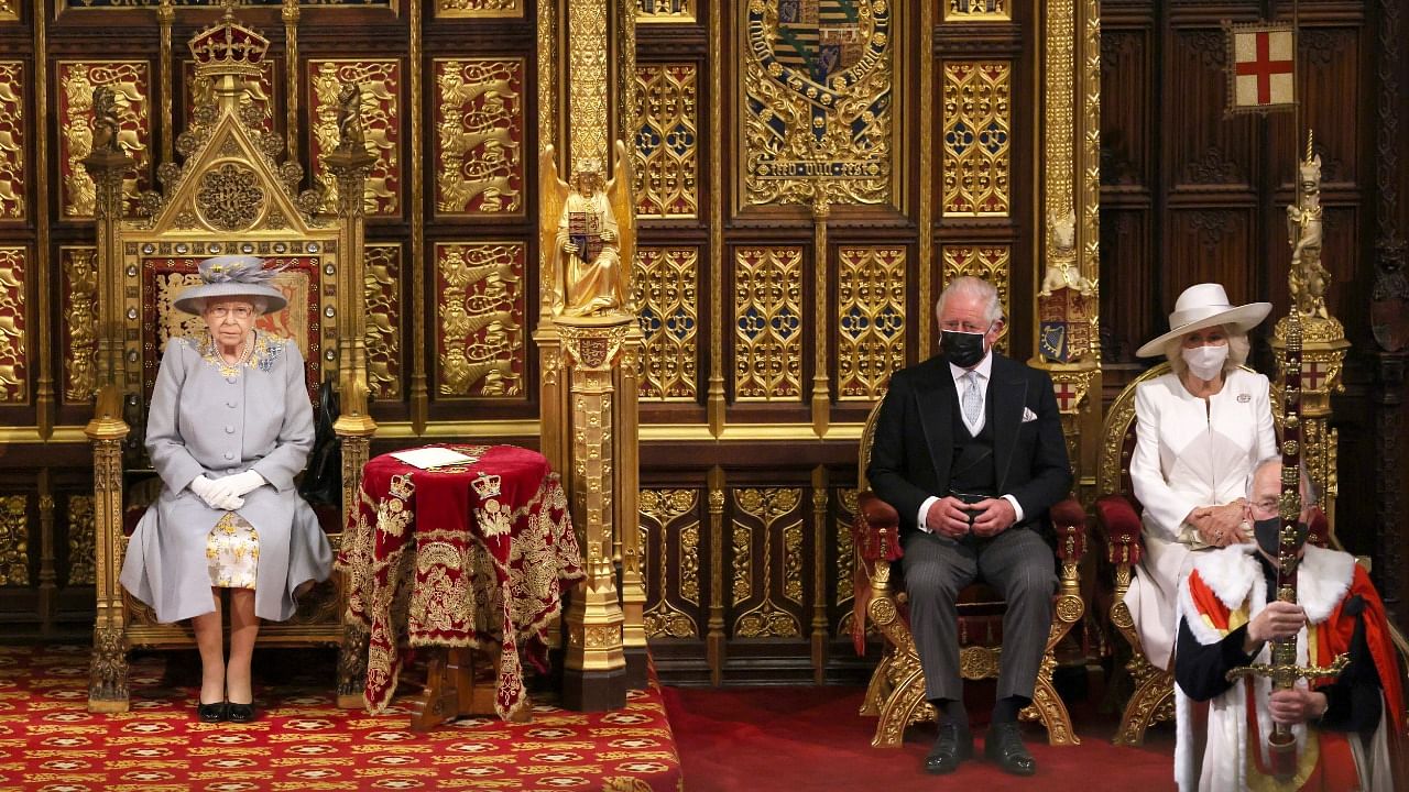 Britain's Queen Elizabeth sits in the House of Lord's Chamber with Prince Charles and Camilla, Duchess of Cornwall for the State Opening of Parliament in London, Britain May 11, 2021. Credit: Reuters Photo