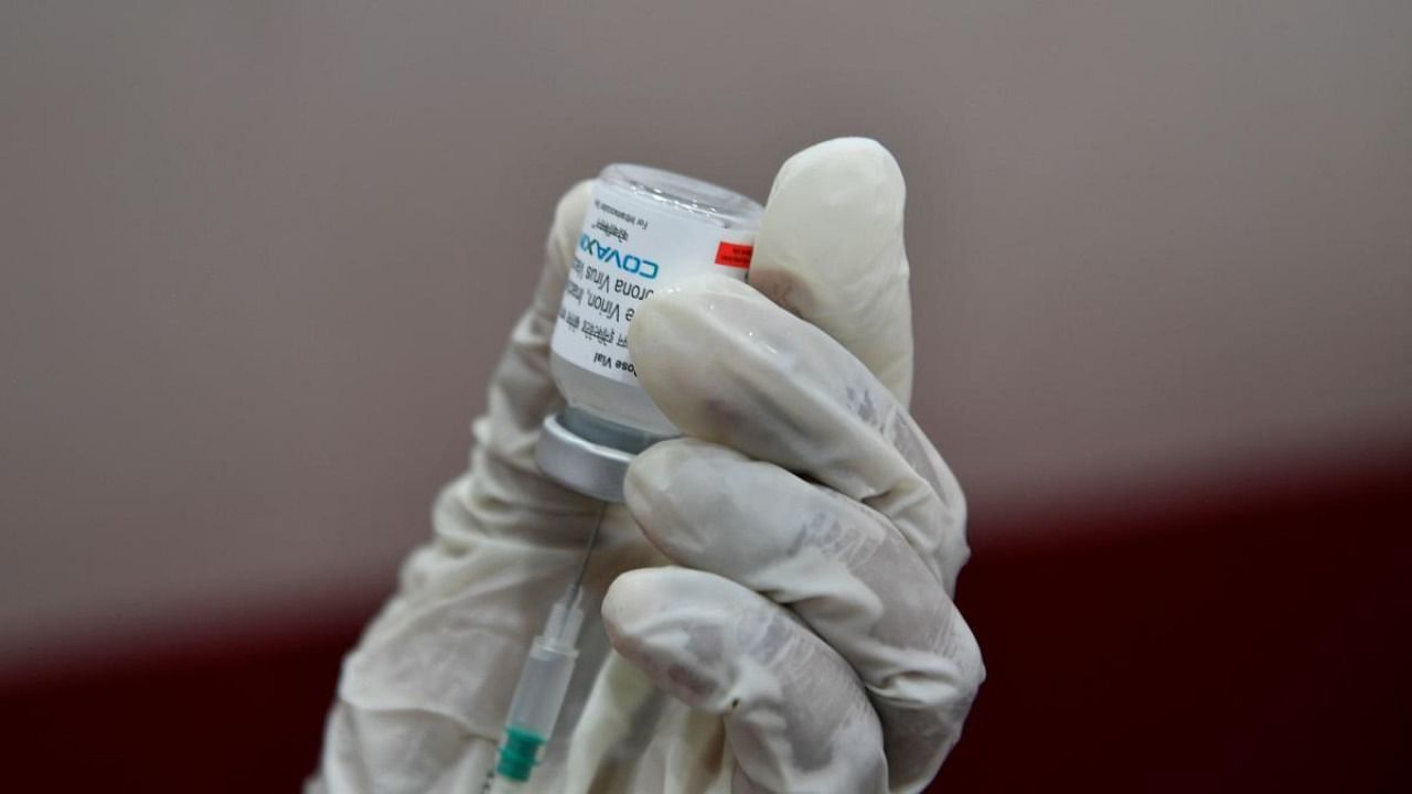 A medical worker prepares to inoculate a person with a dose of the Covaxin vaccine against the Covid-19 coronavirus at a vaccination centre in Mumbai. Credit: AFP Photo