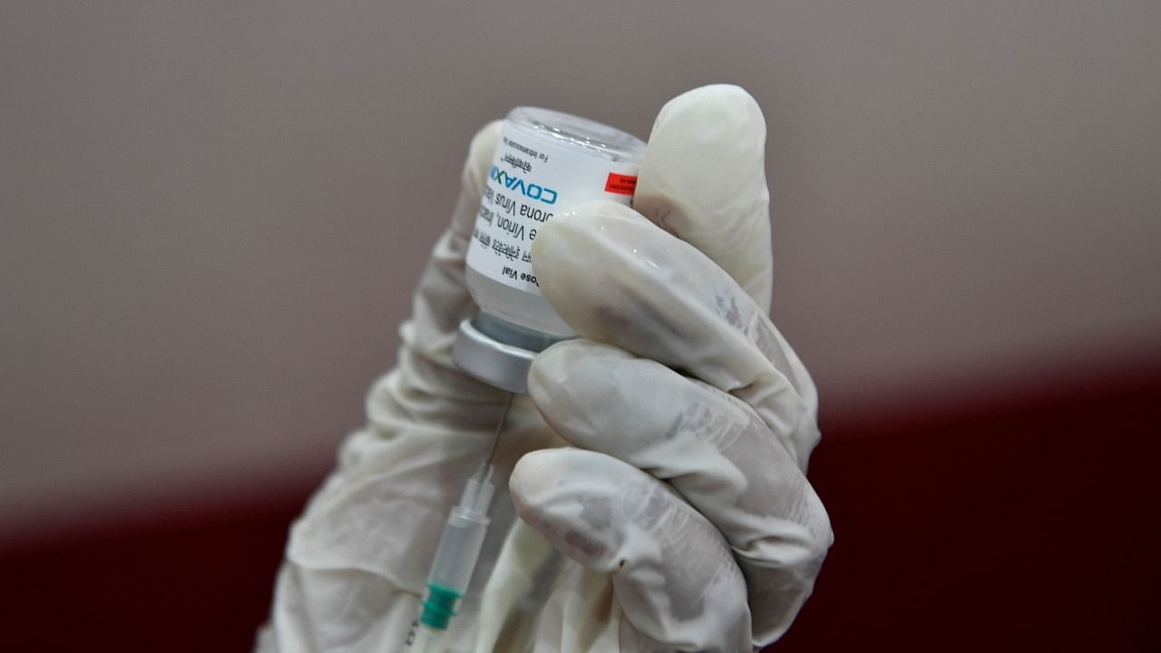 A medical worker prepares to inoculate a person with a dose of the Covaxin vaccine against the Covid-19 coronavirus at a vaccination centre in Mumbai on May 9, 2021. Credit: AFP Photo