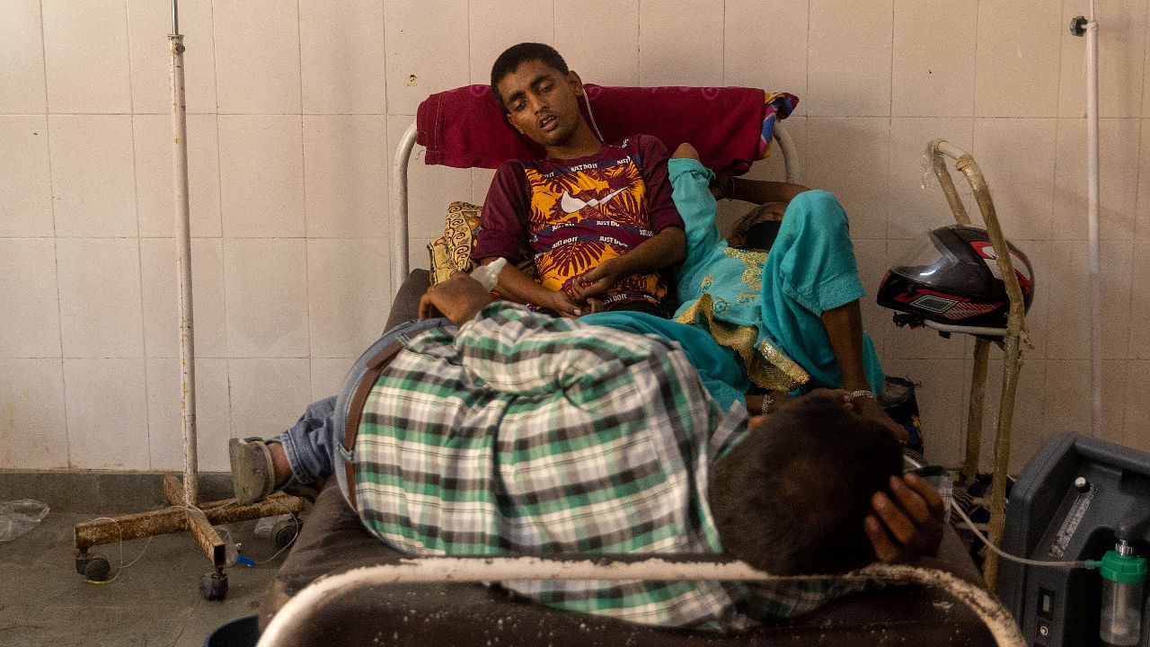Patients receive treatment inside a Covid-19 ward of a government-run hospital in UP's Bijnor. Credit: Reuters Photo