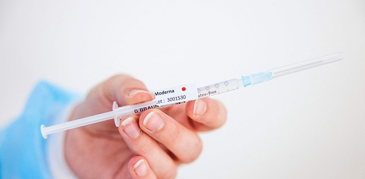 A health worker prepares a dose of Moderna vaccine. credit: AFP Photo