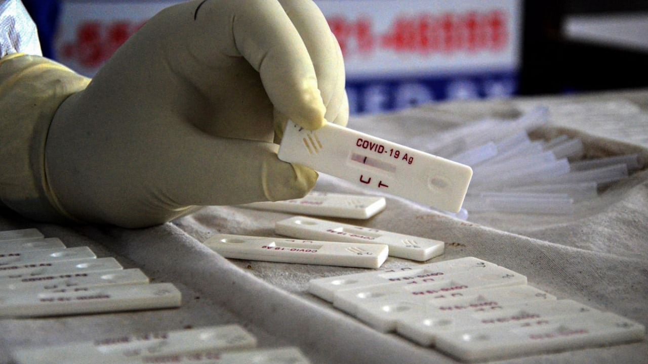  A health worker conducts testing for Covid-19. Credit: PTI Photo