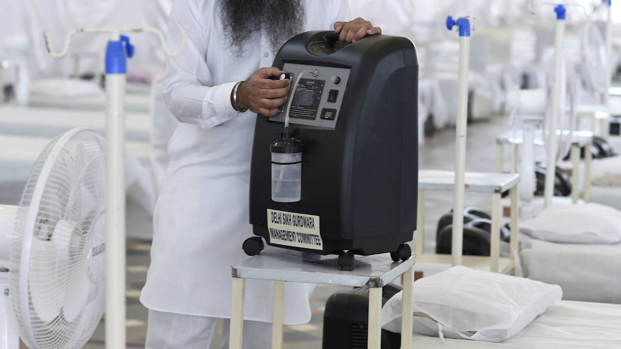 Patients with mild symptoms of Covid-19 can breathe with the help of oxygen concentrators at their home. Credit: PTI Photo