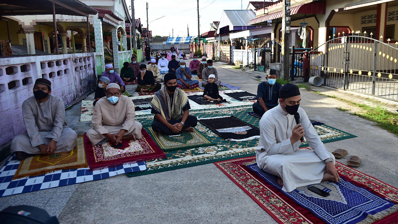 Muslim worshippers perform the morning Eid al-Fitr prayers on the street as authorities closed mosques to prevent the spread of Covid-19. Credit: AFP Photo
