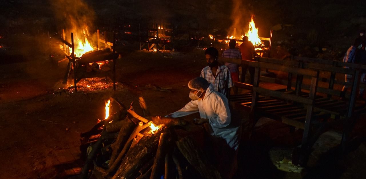 Mass cremation of Covid-19 victims at a crematorium, on the outskirts of Bengaluru. Credit: PTI Photo