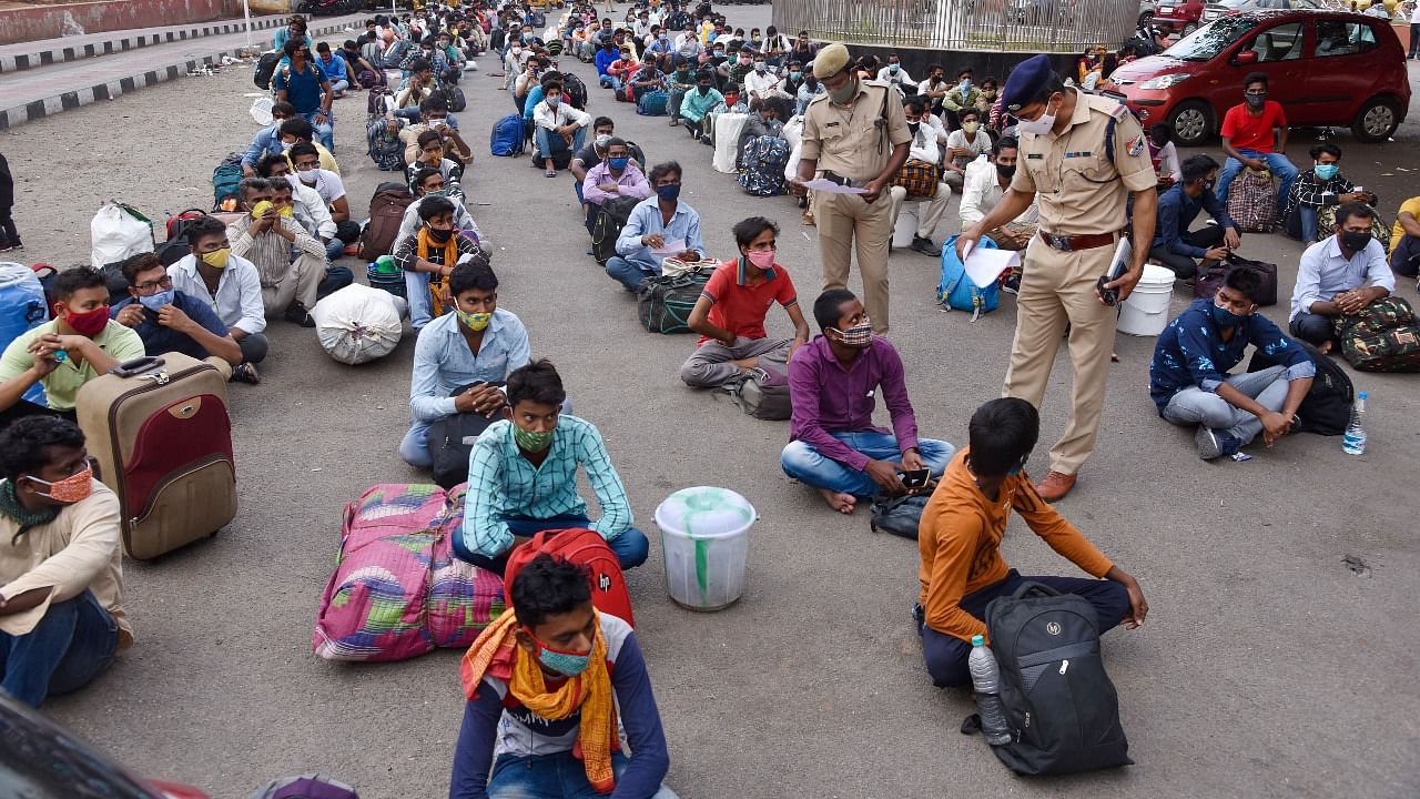 Migrants wait at Secunderabad Railway station, in the hope of returning to their native places, after the Telangana Government announced a lockdown. Credit: PTI Photo