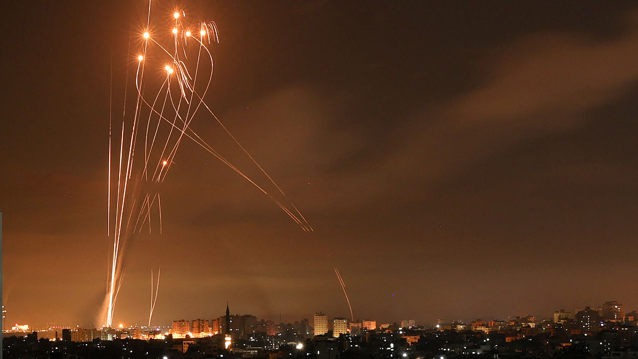 Rockets light up the night sky as they are fired towards Israel from Beit Lahia in the northern Gaza Strip. Credit: AFP Photo