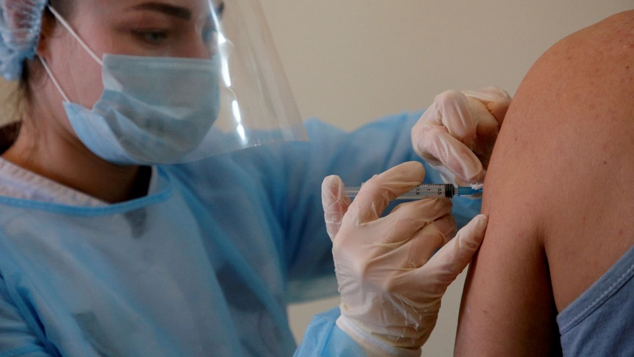 A person receives an injection with Sputnik V vaccine against the coronavirus in Donskoye. Credit: Reuters File Photo