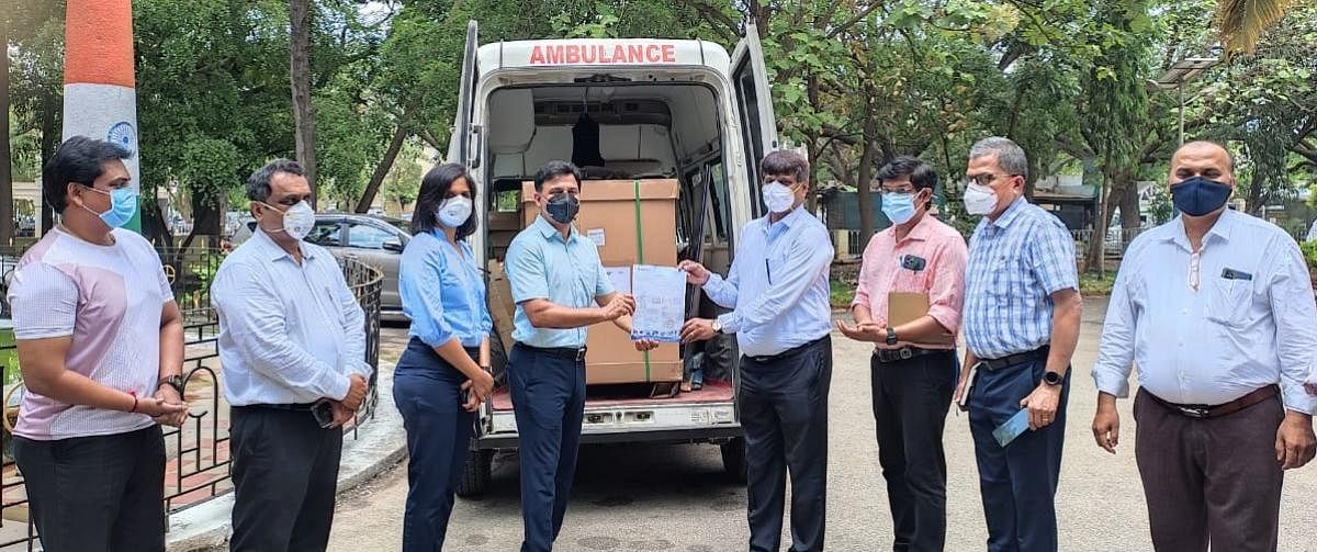 Pavan Ranga, chairman of CII-Mysuru, and Supriya Salian, vice-chairperson, donate ventilators to Dr C P Nanjaraj, Dean, Mysuru Medical College and Research Institute, sponsored by NR Group and Excelsoft Technologies in Mysuru recently.