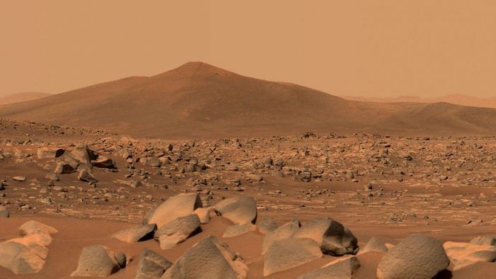 This NASA photo obtained May 12, 2021 shows NASA's Perseverance Mars rover using its dual-camera Mastcam-Z imager to capture this image of "Santa Cruz," a hill about 1.5 miles (2.5 kilometers) away from the rover. Credit: AFP Photo/NASA/JPL-Caltech/MSSS/Handout